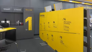 Showroom corporativo de robótica industrial diseñado a medida para Fanuc